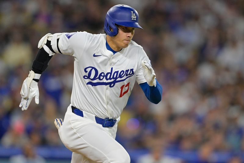 Jun 21, 2024; Los Angeles, California, USA;  Los Angeles Dodgers designated hitter Shohei Ohtani (17) runs out an infield hit in the eighth inning against the Los Angeles Angels at Dodger Stadium. Mandatory Credit: Jayne Kamin-Oncea-USA TODAY Sports