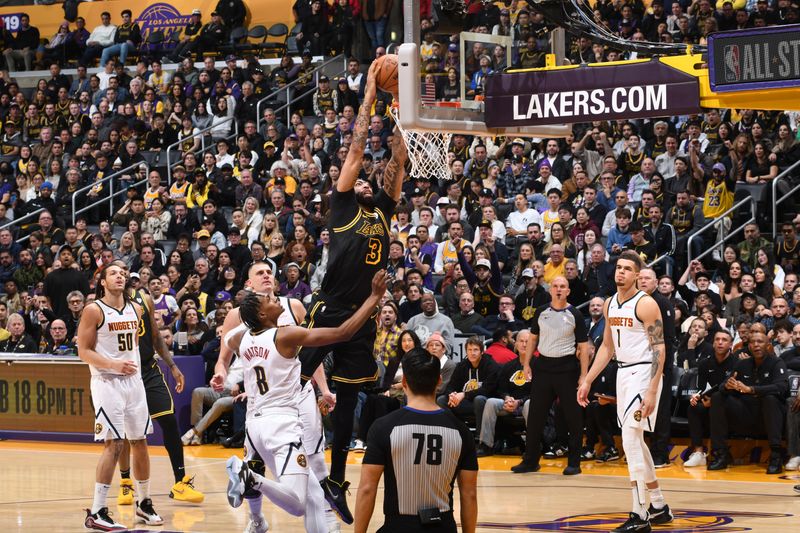 LOS ANGELES, CA - FEBRUARY 8: Anthony Davis #3 of the Los Angeles Lakers drives to the basket during the game against the Denver Nuggets on Feburary 8, 2024 at Crypto.Com Arena in Los Angeles, California. NOTE TO USER: User expressly acknowledges and agrees that, by downloading and/or using this Photograph, user is consenting to the terms and conditions of the Getty Images License Agreement. Mandatory Copyright Notice: Copyright 2024 NBAE (Photo by Andrew D. Bernstein/NBAE via Getty Images)