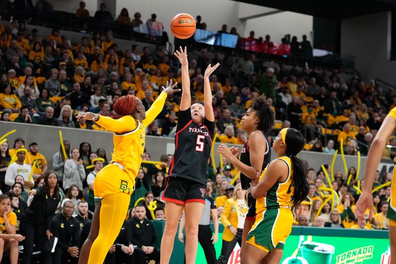 Feb 18, 2024; Waco, Texas, USA;  Texas Tech Red Raiders guard Rhyle McKinney (5) shoots against Baylor Lady Bears guard Aijha Blackwell (33) during the first half at Paul and Alejandra Foster Pavilion. Mandatory Credit: Chris Jones-USA TODAY Sports

