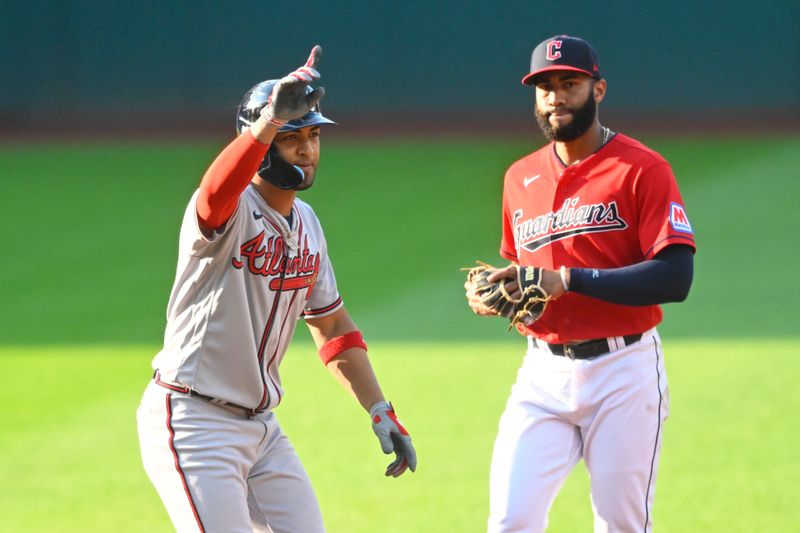 Jul 5, 2023; Cleveland, Ohio, USA; Atlanta Braves left fielder Eddie Rosario (8) celebrates his two-RBI double beside Cleveland Guardians shortstop Amed Rosario (1) in the first inning at Progressive Field. Mandatory Credit: David Richard-USA TODAY Sports