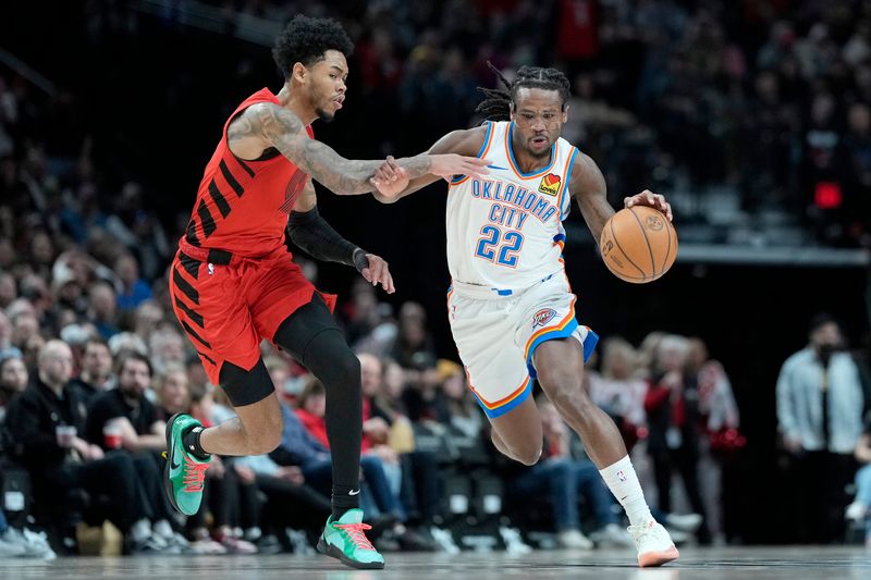 PORTLAND, OREGON - JANUARY 26: Cason Wallace #22 of the Oklahoma City Thunder dribbles the ball against Anfernee Simons (L) #1 of the Portland Trail Blazers during the first half at Moda Center on January 26, 2025 in Portland, Oregon. NOTE TO USER: User expressly acknowledges and agrees that, by downloading and or using this photograph, User is consenting to the terms and conditions of the Getty Images License Agreement. (Photo by Soobum Im/Getty Images)