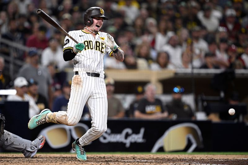 Jul 6, 2024; San Diego, California, USA; San Diego Padres center fielder Jackson Merrill (3) reacts after fouling a ball off his leg during the eighth inning against the Arizona Diamondbacks at Petco Park. Mandatory Credit: Orlando Ramirez-USA TODAY Sports