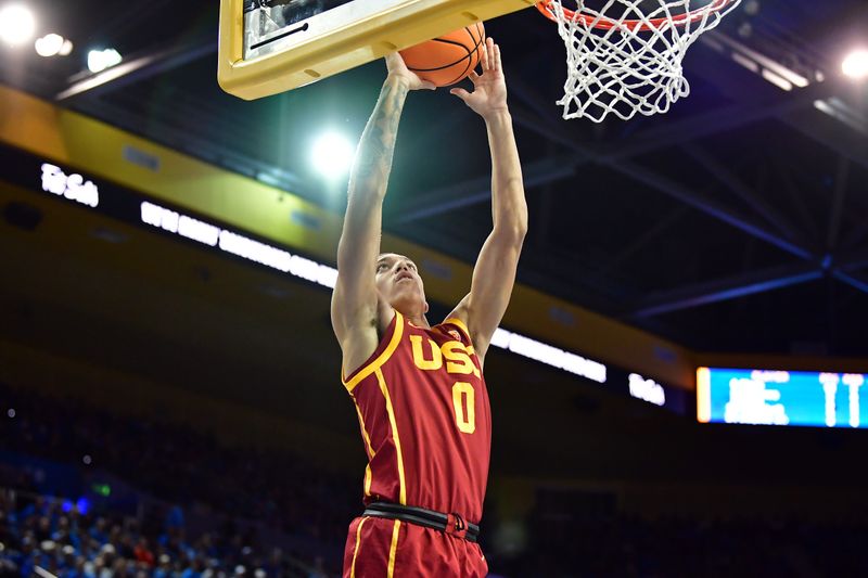 Jan 5, 2023; Los Angeles, California, USA; Southern California Trojans forward Kobe Johnson (0) scores a basket against the UCLA Bruins during the second half at Pauley Pavilion. Mandatory Credit: Gary A. Vasquez-USA TODAY Sports