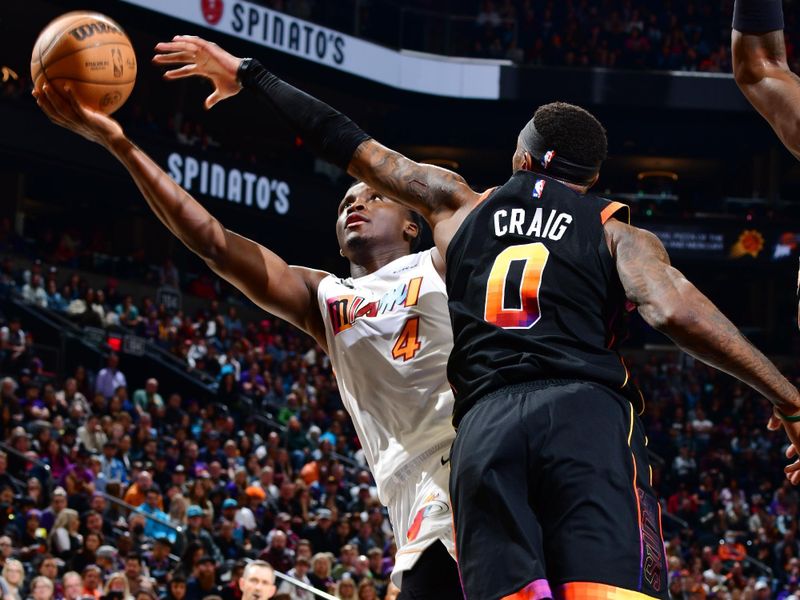 PHOENIX, AZ - JANUARY 6: Victor Oladipo #4 of the Miami Heat drives to the basket during the game against the Phoenix Suns on January 6, 2023 at Footprint Center in Phoenix, Arizona. NOTE TO USER: User expressly acknowledges and agrees that, by downloading and or using this photograph, user is consenting to the terms and conditions of the Getty Images License Agreement. Mandatory Copyright Notice: Copyright 2022 NBAE (Photo by Barry Gossage/NBAE via Getty Images)