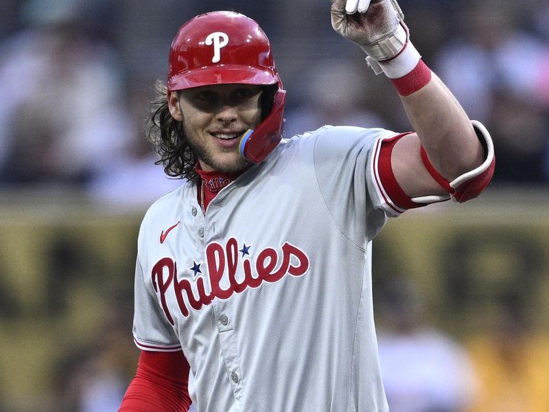 Apr 26, 2024; San Diego, California, USA; Philadelphia Phillies third baseman Alec Bohm (28) celebrates after hitting a double against the San Diego Padres during the first inning at Petco Park. Mandatory Credit: Orlando Ramirez-USA TODAY Sports