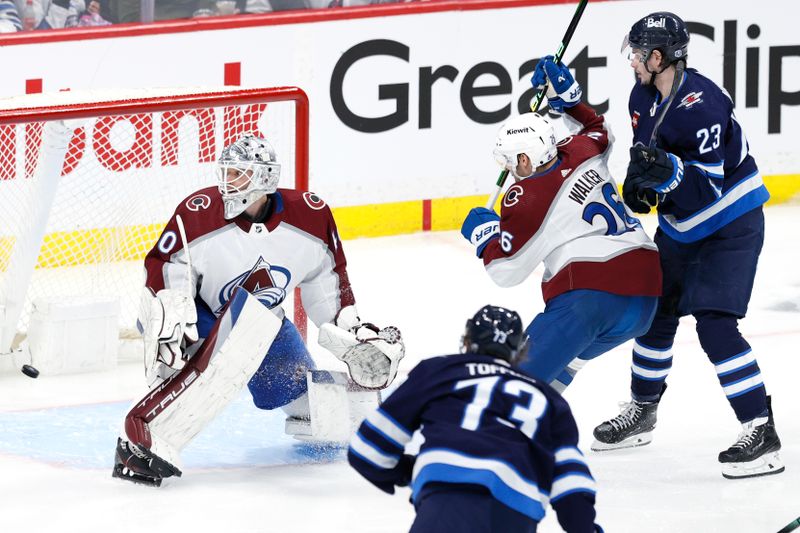 Apr 30, 2024; Winnipeg, Manitoba, CAN; Winnipeg Jets center Tyler Toffoli (73) scores on Colorado Avalanche goaltender Alexandar Georgiev (40) in the third period in game five of the first round of the 2024 Stanley Cup Playoffs at Canada Life Centre. Mandatory Credit: James Carey Lauder-USA TODAY Sports