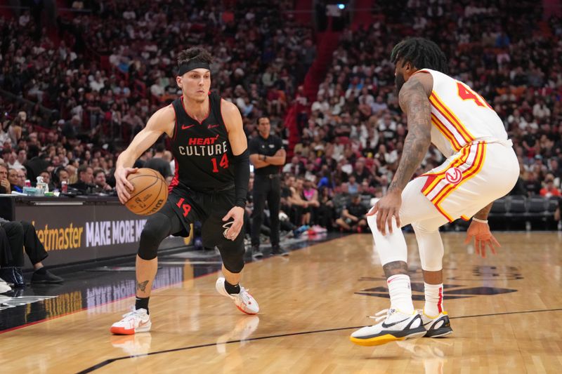 MIAMI, FL - JANUARY 19: Tyler Herro #14 of the Miami Heat dribbles the ball during the game against the Atlanta Hawks on January 19, 2024 at Kaseya Center in Miami, Florida. NOTE TO USER: User expressly acknowledges and agrees that, by downloading and or using this Photograph, user is consenting to the terms and conditions of the Getty Images License Agreement. Mandatory Copyright Notice: Copyright 2024 NBAE (Photo by Eric Espada/NBAE via Getty Images)