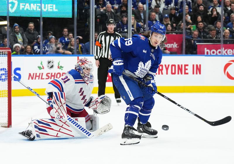 Dec 19, 2023; Toronto, Ontario, CAN; Toronto Maple Leafs left wing Tyler Bertuzzi (59) battles for the puck in front of  New York Rangers goaltender Igor Shesterkin (31) during the third period at Scotiabank Arena. Mandatory Credit: Nick Turchiaro-USA TODAY Sports