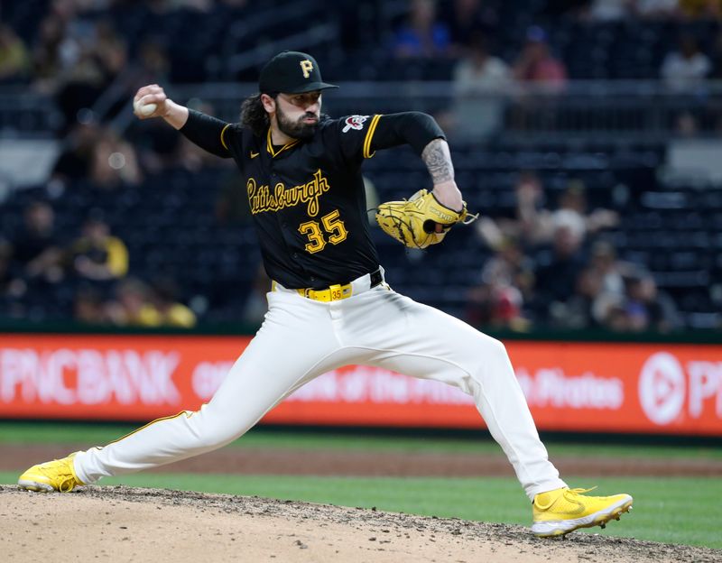 May 22, 2024; Pittsburgh, Pennsylvania, USA;  Pittsburgh Pirates relief pitcher Colin Holderman (35) pitches against the San Francisco Giants during the eighth inning at PNC Park. Mandatory Credit: Charles LeClaire-USA TODAY Sports