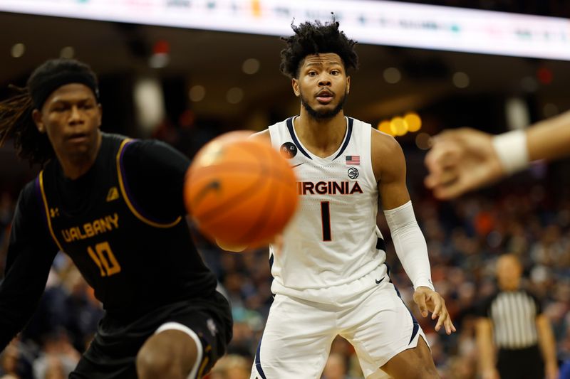 Dec 28, 2022; Charlottesville, Virginia, USA; Virginia Cavaliers forward Jayden Gardner (1) and Albany Great Danes forward Aaron Reddish (10) follow the ball in the second half at John Paul Jones Arena. Mandatory Credit: Geoff Burke-USA TODAY Sports