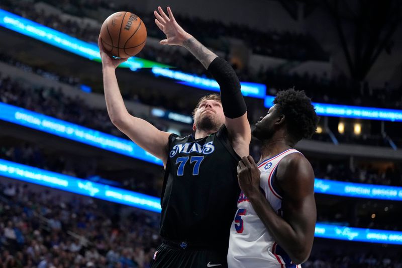 DALLAS, TEXAS - MARCH 03: Luka Doncic #77 of the Dallas Mavericks is defended by Mo Bamba #5 of the Philadelphia 76ers during the second half at American Airlines Center on March 03, 2024 in Dallas, Texas. NOTE TO USER: User expressly acknowledges and agrees that, by downloading and or using this photograph, User is consenting to the terms and conditions of the Getty Images License Agreement. (Photo by Sam Hodde/Getty Images)