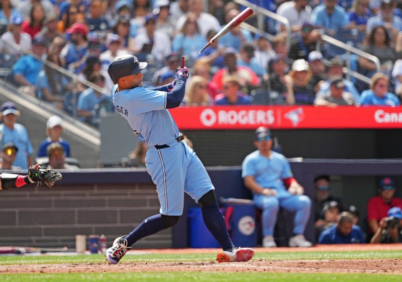 Aug 25, 2024; Toronto, Ontario, CAN; Toronto Blue Jays designated hitter George Springer (4) hits a broken bat single against the Los Angeles Angels during the fourth inning at Rogers Centre. Mandatory Credit: Nick Turchiaro-USA TODAY Sports