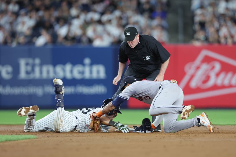 May 8, 2024; Bronx, New York, USA; New York Yankees catcher Austin Wells (28) slides safely into second base for a double ahead of a tag by Houston Astros shortstop Jeremy Pena (3) during the sixth inning at Yankee Stadium. Mandatory Credit: Brad Penner-USA TODAY Sports