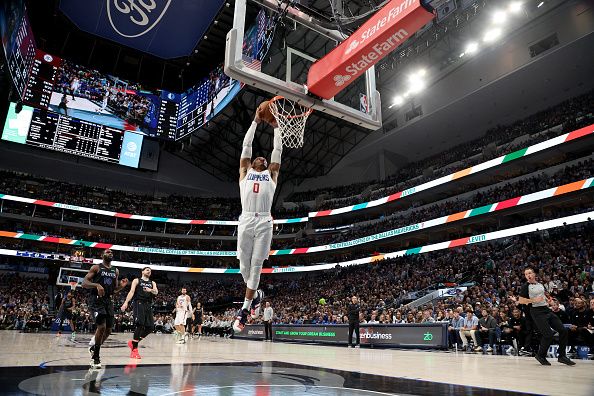 DALLAS, TEXAS - DECEMBER 20: Russell Westbrook #0 of the LA Clippers dunks the ball in the second half against the LA Clippers at American Airlines Center on December 20, 2023 in Dallas, Texas. NOTE TO USER: User expressly acknowledges and agrees that, by downloading and or using this photograph, User is consenting to the terms and conditions of the Getty Images License Agreement. (Photo by Tim Heitman/Getty Images)