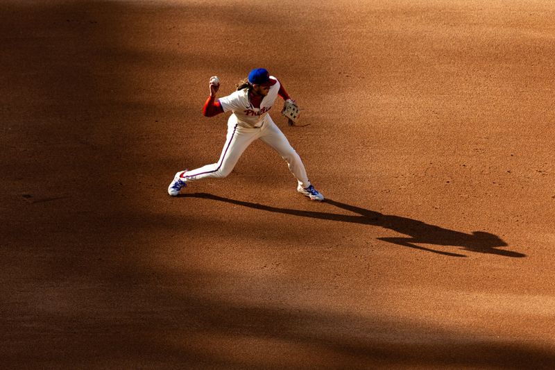 Apr 13, 2024; Philadelphia, Pennsylvania, USA; Philadelphia Phillies third base Alec Bohm (28) throws out Pittsburgh Pirates outfielder Edward Olivares (not pictured) at second during the fourth inning against the Pittsburgh Pirates at Citizens Bank Park. Mandatory Credit: Bill Streicher-USA TODAY Sports