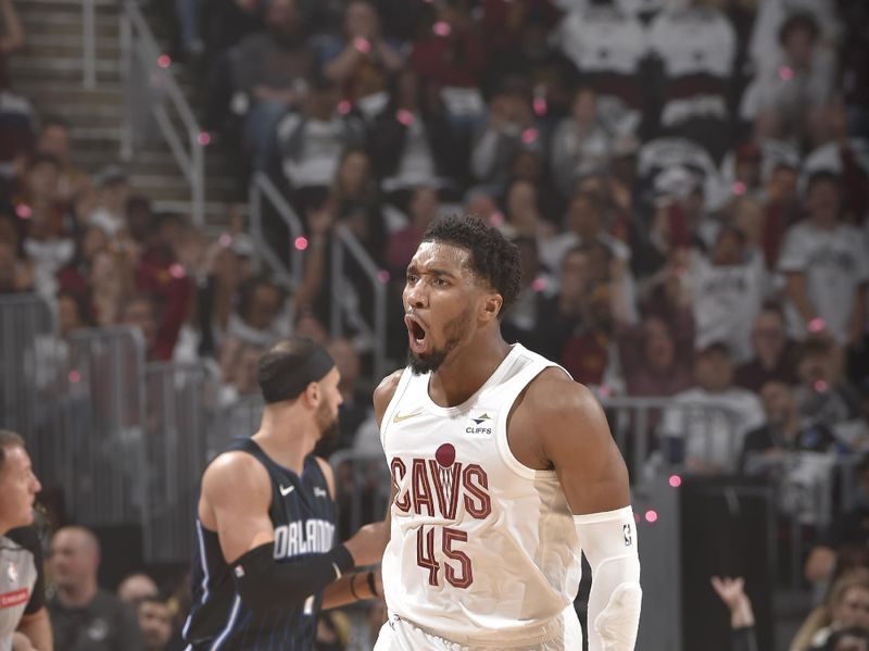 CLEVELAND, OH - APRIL 22: Donovan Mitchell #45 of the Cleveland Cavaliers celebrates a three point basket during the game against the Orlando Magic during Round 1 Game 2 of the 2024 NBA Playoffs on April 22, 2024 at Rocket Mortgage FieldHouse in Cleveland, Ohio. NOTE TO USER: User expressly acknowledges and agrees that, by downloading and/or using this Photograph, user is consenting to the terms and conditions of the Getty Images License Agreement. Mandatory Copyright Notice: Copyright 2024 NBAE (Photo by David Liam Kyle/NBAE via Getty Images)