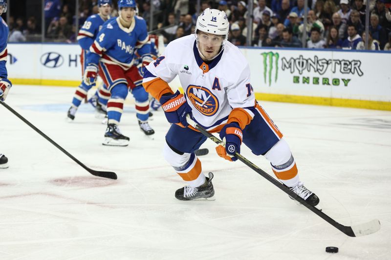 Nov 8, 2025; New York, New York, USA;  New York Islanders center Bo Horvat (14) controls the puck in the second period against the New York Rangers at Madison Square Garden. Mandatory Credit: Wendell Cruz-Imagn Images