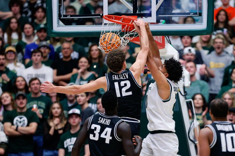 Feb 17, 2024; Fort Collins, Colorado, USA; Colorado State Rams guard Rashaan Mbemba (21) dunks the ball against Utah State Aggies guard Mason Falslev (12) in the first half at Moby Arena. Mandatory Credit: Isaiah J. Downing-USA TODAY Sports