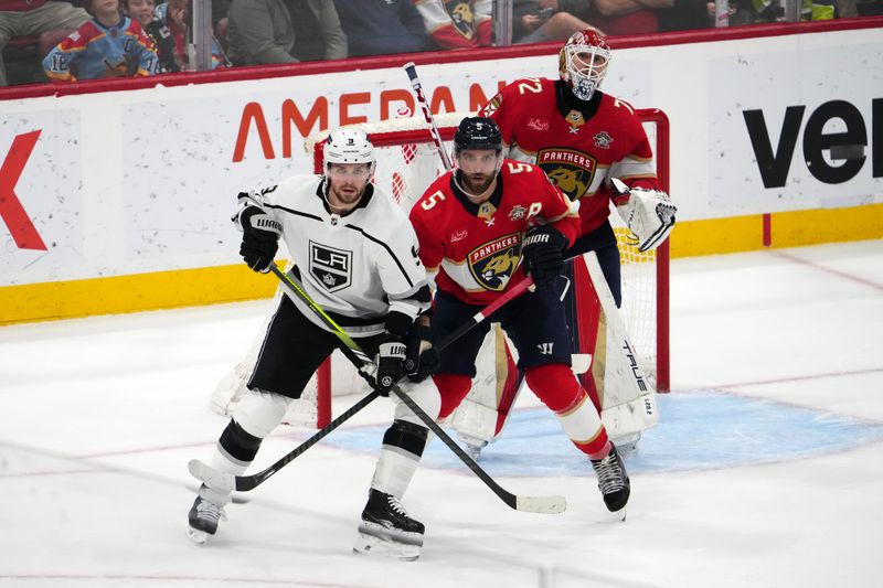 Jan 11, 2024; Sunrise, Florida, USA; Los Angeles Kings right wing Adrian Kempe (9) battles Florida Panthers defenseman Aaron Ekblad (5) for position in front of goaltender Sergei Bobrovsky (72) during the second period at Amerant Bank Arena. Mandatory Credit: Jasen Vinlove-USA TODAY Sports