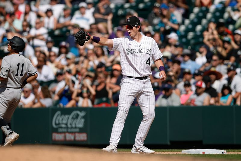 Jul 16, 2023; Denver, Colorado, USA; Colorado Rockies first baseman Michael Toglia (4) gestures after a play in the tenth inning against the New York Yankees at Coors Field. Mandatory Credit: Isaiah J. Downing-USA TODAY Sports