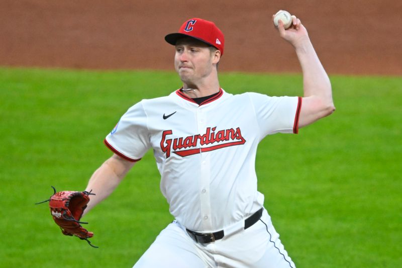 Apr 12, 2025; Cleveland, Ohio, USA; Cleveland Guardians relief pitcher Tim Herrin (29) delivers a pitch in the sixth inning against the Kansas City Royals at Progressive Field. Mandatory Credit: David Richard-Imagn Images