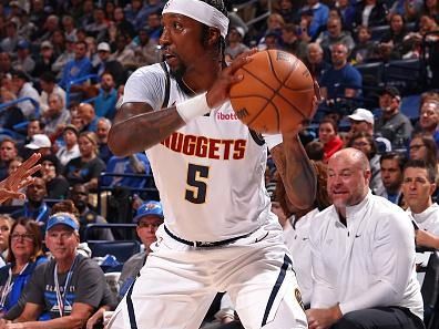 OKLAHOMA CITY, OK - OCTOBER 29: Kentavious Caldwell-Pope #5 of the Denver Nuggets looks to pass the ball during the game against the Oklahoma City Thunder on October 29, 2023 at Paycom Center in Oklahoma City, Oklahoma. NOTE TO USER: User expressly acknowledges and agrees that, by downloading and or using this photograph, User is consenting to the terms and conditions of the Getty Images License Agreement. Mandatory Copyright Notice: Copyright 2023 NBAE (Photo by Zach Beeker/NBAE via Getty Images)