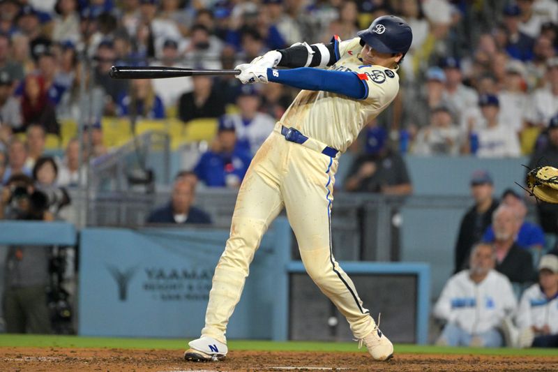 Sep 20, 2025; Los Angeles, California, USA;  Los Angeles Dodgers designated hitter Shohei Ohtani (17) hits a solo home run in the fifth inning against the San Francisco Giants at Dodger Stadium. Mandatory Credit: Jayne Kamin-Oncea-Imagn Images
