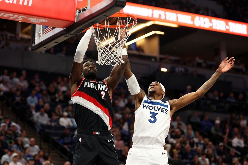 MINNEAPOLIS, MINNESOTA - NOVEMBER 08: Deandre Ayton #2 of the Portland Trail Blazers dunks the ball against Jaden McDaniels #3 of the Minnesota Timberwolves in the second quarter at Target Center on November 08, 2024 in Minneapolis, Minnesota. NOTE TO USER: User expressly acknowledges and agrees that, by downloading and or using this photograph, User is consenting to the terms and conditions of the Getty Images License Agreement. (Photo by David Berding/Getty Images)