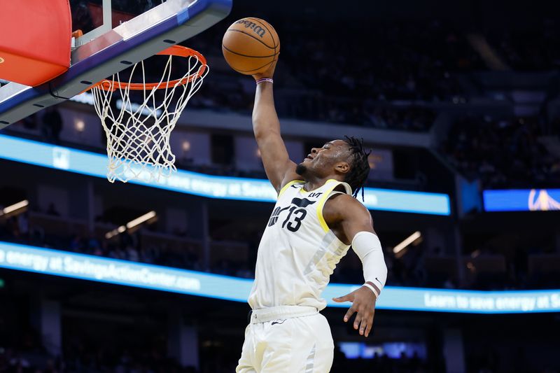 SAN FRANCISCO, CALIFORNIA - JANUARY 28: Isaiah Collier #13 of the Utah Jazz dunks the ball in the third quarter against the Golden State Warriors at Chase Center on January 28, 2025 in San Francisco, California. NOTE TO USER: User expressly acknowledges and agrees that, by downloading and or using this photograph, User is consenting to the terms and conditions of the Getty Images License Agreement. (Photo by Lachlan Cunningham/Getty Images)