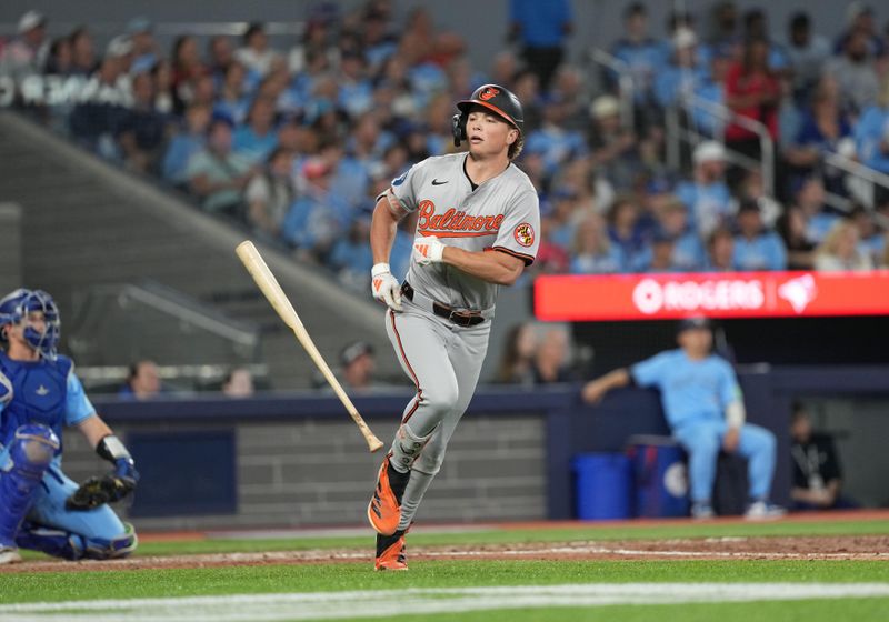Aug 7, 2024; Toronto, Ontario, CAN; Baltimore Orioles second baseman Jackson Holliday (7) flips his bat after hitting a two run home run against the Toronto Blue Jays during the seventh inning at Rogers Centre. Mandatory Credit: Nick Turchiaro-USA TODAY Sports