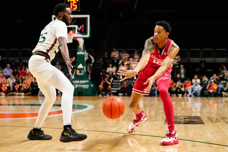 Feb 11, 2023; Coral Gables, Florida, USA; Louisville Cardinals forward JJ Traynor (12) throws a pass against the Miami (Fl) Hurricanes during the first half at Watsco Center. Mandatory Credit: Rich Storry-USA TODAY Sports