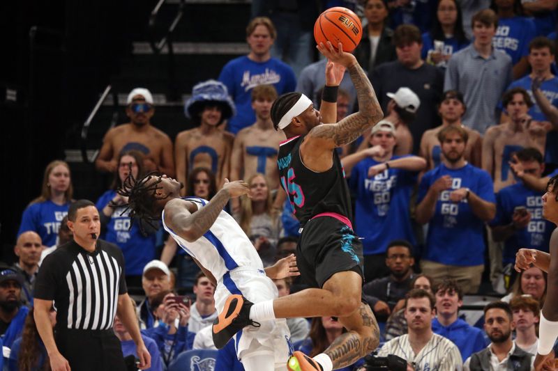 Feb 25, 2024; Memphis, Tennessee, USA; Florida Atlantic Owls guard Alijah Martin (15) shoots as Memphis Tigers guard Jaykwon Walton (10) defends during the first half at FedExForum. Mandatory Credit: Petre Thomas-USA TODAY Sports