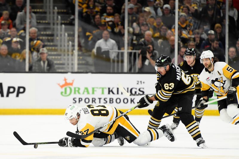 Jan 4, 2024; Boston, Massachusetts, USA; Pittsburgh Penguins center Sidney Crosby (87) and Boston Bruins left wing Brad Marchand (63) battle for the puck during the second period at TD Garden. Mandatory Credit: Bob DeChiara-USA TODAY Sports