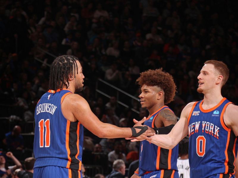 NEW YORK, NY - MARCH 23: Donte Divincenzo #0 and Jalen Brunson #11 of the New York Knicks celebrate during the game against the Brooklyn Nets on March 23, 2024 at Madison Square Garden in New York City, New York.  NOTE TO USER: User expressly acknowledges and agrees that, by downloading and or using this photograph, User is consenting to the terms and conditions of the Getty Images License Agreement. Mandatory Copyright Notice: Copyright 2024 NBAE  (Photo by Nathaniel S. Butler/NBAE via Getty Images)