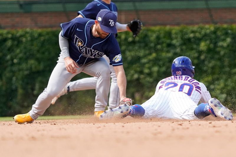 May 31, 2023; Chicago, Illinois, USA; Chicago Cubs second baseman Miles Mastrobuoni (20) steals second base as Tampa Bay Rays second baseman Brandon Lowe (8) takes the throw during the eighth inning at Wrigley Field. Mandatory Credit: David Banks-USA TODAY Sports