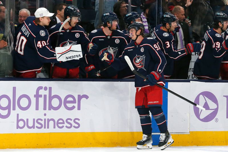 Nov 21, 2024; Columbus, Ohio, USA; Columbus Blue Jackets center Kent Johnson (91) celebrates his goal against the Tampa Bay Lightning during the third period at Nationwide Arena. Mandatory Credit: Russell LaBounty-Imagn Images