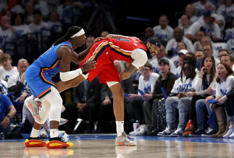 OKLAHOMA CITY, OKLAHOMA - APRIL 24:  Brandon Ingram #14 of the New Orleans Pelicans controls the ball as Luguentz Dort #5 of the Oklahoma City Thunder defends during game two of the first round of the NBA playoffs at Paycom Center on April 24, 2024 in Oklahoma City, Oklahoma. (Photo by Jamie Squire/Getty Images)