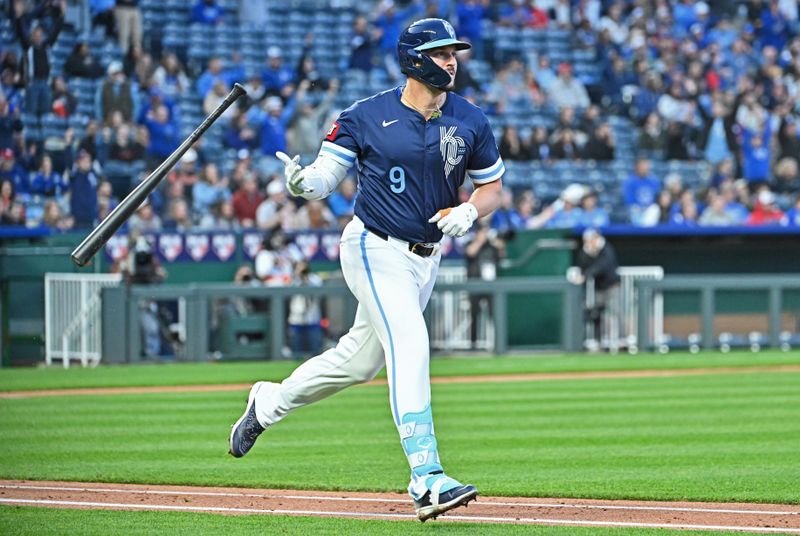 Apr 19, 2024; Kansas City, Missouri, USA; Kansas City Royals first baseman Vinnie Pasquantino (9) flips the bat after hitting a solo home run in the fourth inning against the Baltimore Orioles at Kauffman Stadium. Mandatory Credit: Peter Aiken-USA TODAY Sports