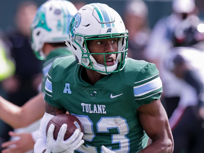 Oct 30, 2021; New Orleans, Louisiana, USA;  Tulane Green Wave wide receiver Jaetavian Toles (23) runs against Cincinnati Bearcats during the second half at Yulman Stadium. Mandatory Credit: Stephen Lew-USA TODAY Sports