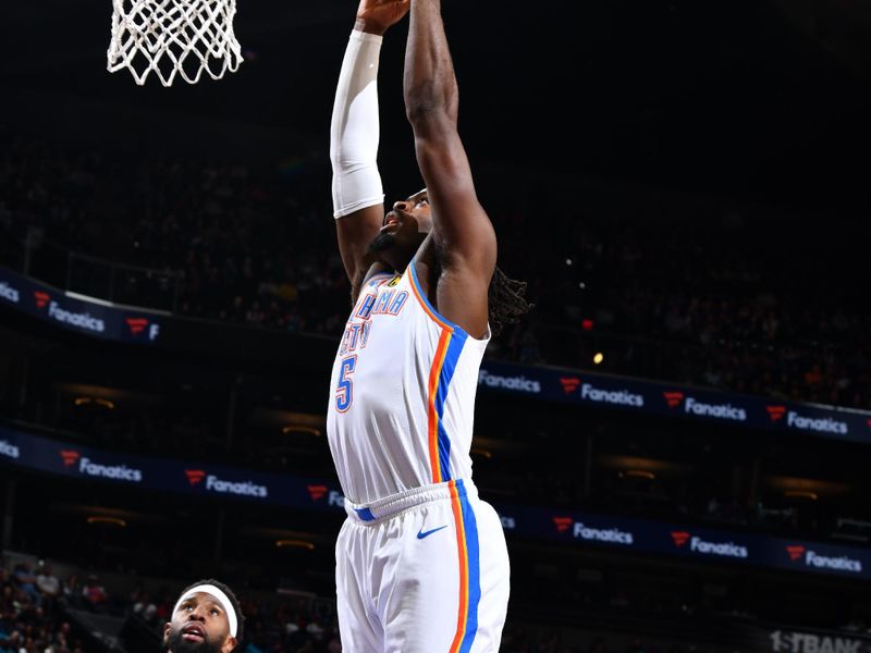 PHOENIX, AZ - MARCH 3: Luguentz Dort #5 of the Oklahoma City Thunder dunks the ball during the game against the Phoenix Suns on March 3, 2024 at Footprint Center in Phoenix, Arizona. NOTE TO USER: User expressly acknowledges and agrees that, by downloading and or using this photograph, user is consenting to the terms and conditions of the Getty Images License Agreement. Mandatory Copyright Notice: Copyright 2024 NBAE (Photo by Barry Gossage/NBAE via Getty Images)