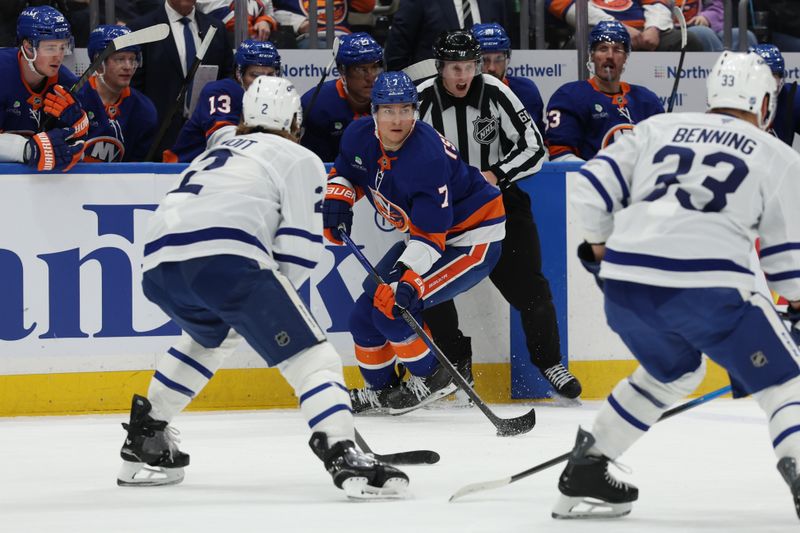 Jan 3, 2026; Elmont, New York, USA;  New York Islanders right wing Maxim Tsyplakov (7) controls the puck against the Toronto Maple Leafs during the second period at UBS Arena. Mandatory Credit: Thomas Salus-Imagn Images