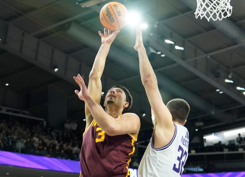 Mar 9, 2024; Evanston, Illinois, USA; Northwestern Wildcats forward Blake Preston (32) defends Minnesota Golden Gophers forward Dawson Garcia (3) during the first half at Welsh-Ryan Arena. Mandatory Credit: David Banks-USA TODAY Sports