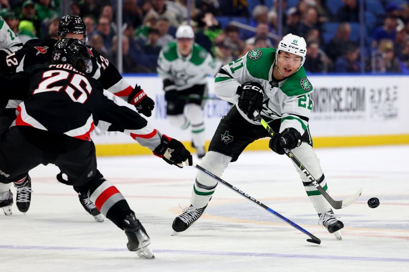 Feb 6, 2024; Buffalo, New York, USA;  Dallas Stars left wing Jason Robertson (21) flips the puck up ice during the third period against the Buffalo Sabres at KeyBank Center. Mandatory Credit: Timothy T. Ludwig-USA TODAY Sports