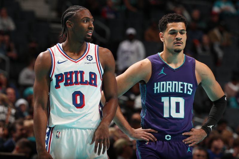 CHARLOTTE, NC - DECEMBER 3: Tyrese Maxey #0 of the Philadelphia 76ers and Josh Green #10 of the Charlotte Hornets looks on during the game during an NBA Emirates Cup game on December 3, 2024 at Spectrum Center in Charlotte, North Carolina. NOTE TO USER: User expressly acknowledges and agrees that, by downloading and or using this photograph, User is consenting to the terms and conditions of the Getty Images License Agreement. Mandatory Copyright Notice: Copyright 2024 NBAE (Photo by Kent Smith/NBAE via Getty Images)