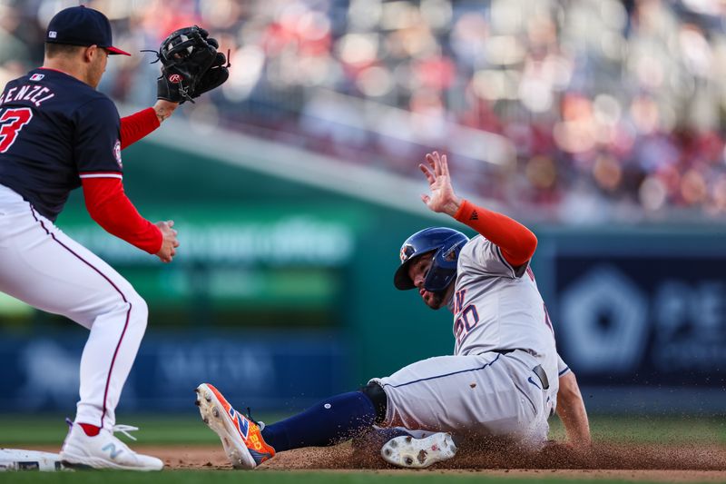 Apr 20, 2024; Washington, District of Columbia, USA; Houston Astros outfielder Chas McCormick (20) steals third base in front of Washington Nationals third base Nick Senzel (13) during the ninth inning at Nationals Park. Mandatory Credit: Scott Taetsch-USA TODAY Sports