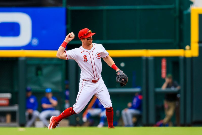 May 25, 2025; Cincinnati, Ohio, USA; Cincinnati Reds second baseman Matt McLain (9) throws to first to get Chicago Cubs first baseman Justin Turner (not pictured) out in the second inning at Great American Ball Park. Mandatory Credit: Katie Stratman-Imagn Images