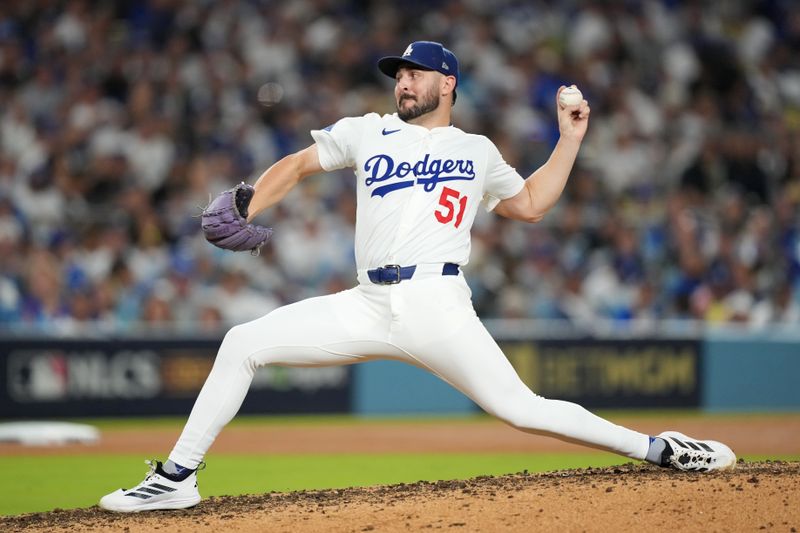 Oct 17, 2025; Los Angeles, California, USA; Los Angeles Dodgers pitcher Alex Vesia (51) pitches against the Milwaukee Brewers in the seventh inning during game four of the NLCS round for the 2025 MLB playoffs at Dodger Stadium. Mandatory Credit: Kirby Lee-Imagn Images