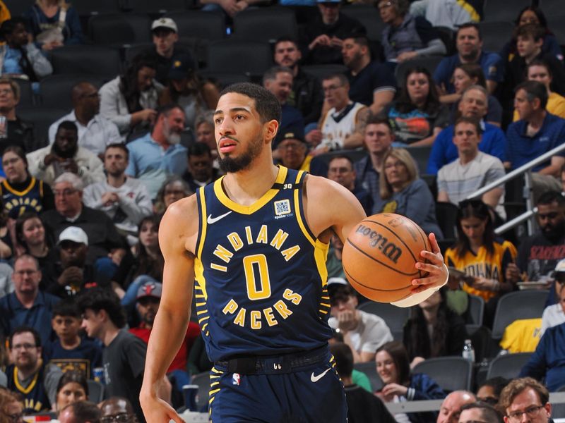 INDIANAPOLIS, IN - MARCH 13:  Tyrese Haliburton #0 of the Indiana Pacers handles the ball during the game  on March 13, 2024 at Gainbridge Fieldhouse in Indianapolis, Indiana. NOTE TO USER: User expressly acknowledges and agrees that, by downloading and or using this Photograph, user is consenting to the terms and conditions of the Getty Images License Agreement. Mandatory Copyright Notice: Copyright 2024 NBAE (Photo by Ron Hoskins/NBAE via Getty Images)