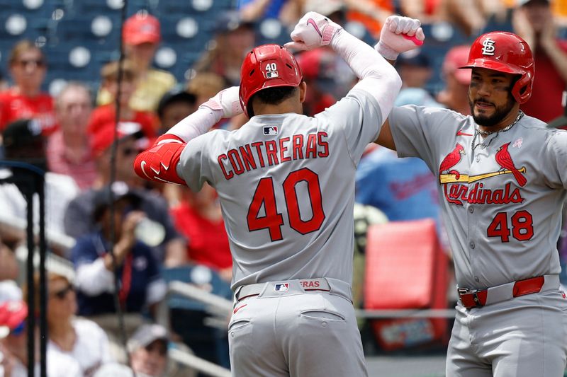 May 11, 2025; Washington, District of Columbia, USA; St. Louis Cardinals first base Willson Contreras (40) celebrates with Cardinals catcher Iván Herrera (48) after hitting a solo home run against the Washington Nationals during the second inning at Nationals Park. Mandatory Credit: Geoff Burke-Imagn Images
