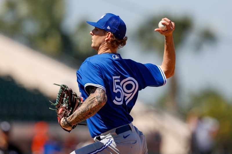 Mar 21, 2022; Lakeland, Florida, USA; Toronto Blue Jays pitcher Bowden Francis (59) throws a pitch in the sixth inning against the Detroit Tigers during spring training at Publix Field at Joker Marchant Stadium. Mandatory Credit: Nathan Ray Seebeck-USA TODAY Sports